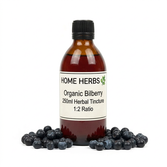 An amber glass bottle of Home Herbs Organic Bilberry 250ml Herbal Tincture with a black cap and white label, surrounded by fresh blueberries on a white background.