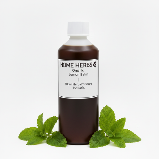 A 500ml bottle of Home Herbs Organic Lemon Balm herbal tincture, 1:2 ratio, shown with green lemon balm leaves at its base on a clean white background.