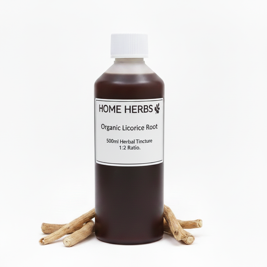 A 500ml bottle of Home Herbs Organic Licorice Root herbal tincture, filled with dark brown liquid and standing upright on a white background, flanked by several small licorice roots.