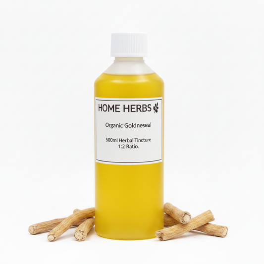 A 500ml bottle of Home Herbs Organic Goldneseal herbal tincture, filled with yellow liquid and topped with a white cap, displayed on a white background with several dried goldneseal roots arranged at its base.