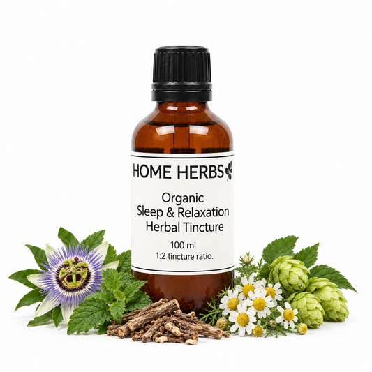A 100 ml amber glass bottle of Home Herbs Organic Sleep & Relaxation Herbal Tincture, surrounded by its natural ingredients including chamomile flowers, green hops, a purple passion flower, mint leaves, and dried roots on a white background.
