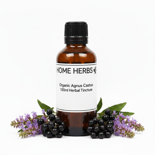 An amber glass bottle of Home Herbs Organic Agnus Castus 100ml Herbal Tincture, styled with fresh agnus castus berries and purple flowers on a white background.