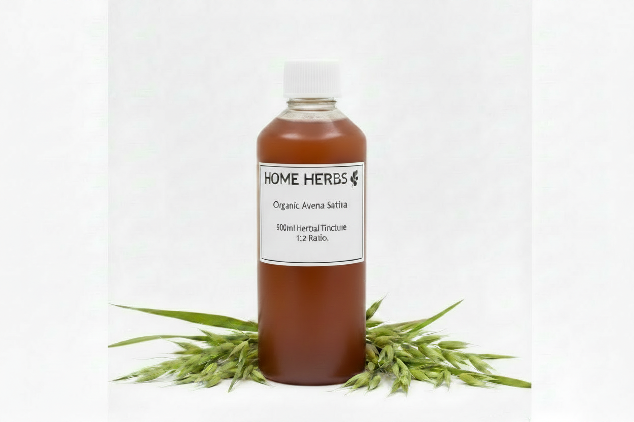 A 500ml bottle of Home Herbs Organic Avena Sativa herbal tincture, filled with an amber-brown liquid and topped with a white cap, displayed on a white background with green oat grass sprigs at its base.