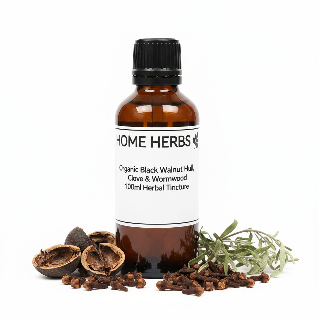 A 100ml amber glass bottle of Home Herbs Organic Black Walnut Hull, Clove & Wormwood Blended Herbal Tincture, styled with whole cloves, black walnut hulls, and a sprig of wormwood on a white background.