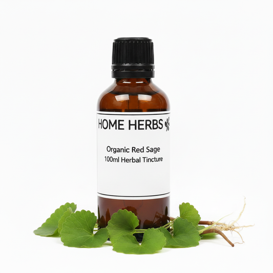 An amber glass bottle of Home Herbs Organic Red Sage Herbal Tincture with a black cap and white label, styled with fresh green red sage leaves and roots in the foreground on a white background.